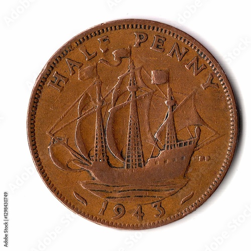 The reverse of an antique King George VI coin from Great Britain.