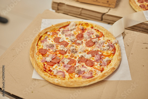 a professional chef assembles and cooks a delicious pizza. photo