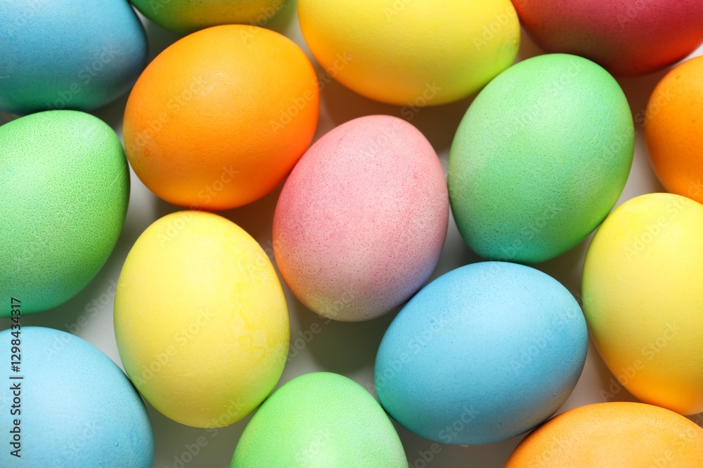 Beautiful decorated Easter eggs on light background, top view Beautiful decorated Easter eggs on light background, top view