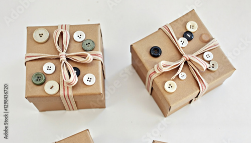 Creative handmade button-decorated gift boxes for personalized presents on a light background