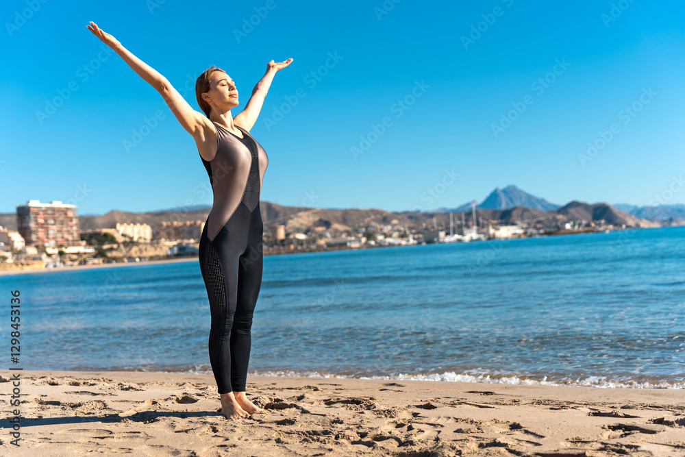 Woman practicing yoga asana on the beach, embracing mindfulness and breathing Woman practicing yoga asana on the beach, embracing mindfulness and breathing