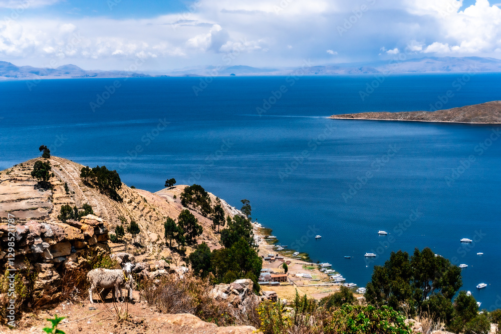 Panoramic View of Lake Titicaca With Recreational Boats Floating on the Water Seen From Isla del Sol Bolivia With Majestic Andean Mountains in the Background Panoramic View of Lake Titicaca With Recreational Boats Floating on the Water Seen From Isla del Sol Bolivia With Majestic Andean Mountains in the Background