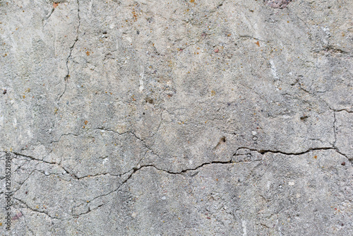 
Gray cracked concrete wall.