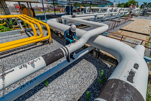 Male worker inspection and measurement thickness pipeline oil and gas at check record pipeline