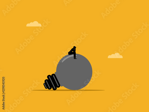 Stressed businessman can think on burned out light bulb