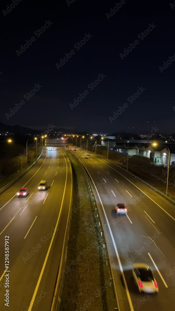 Cars driving on the highway at night (Vertical video)
Cars driving on the highway at night (Vertical video)