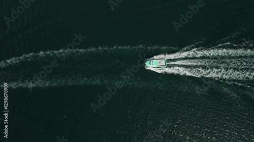Wallpaper Mural A Luxury Motorboat Sailing Through The Vast Ocean Waters In A Slow-Motion Aerial Shot. The Waves From The Yacht Create A Stunning Visual, Perfect For Capturing The Beauty Of The Sea. Torontodigital.ca