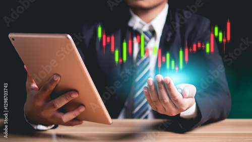 Wallpaper Mural Man holding tablet with stock market chart, candlestick chart, stock trading and data analysis, presentation and digital media related to finance, technology and investment." Torontodigital.ca