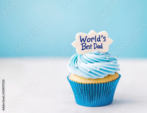 Father's day cupcake with blue frosting and gratitude topper. with copy space. Concept for father's day celebration, birthday, appreciation.