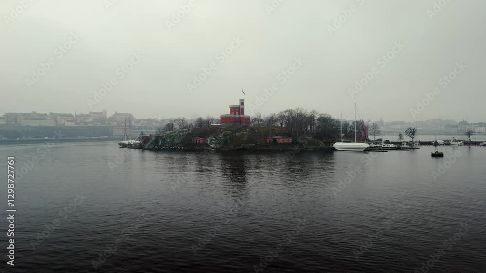 Drone shot pushing forward towards a castle on an island. Foggy day. Drone shot pushing forward towards a castle on an island. Foggy day.