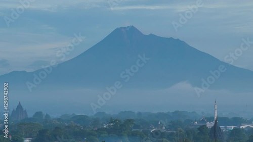 Jogja, Indonesia - February 5, 2025. 4k timelapse, morning atmosphere in Prambanan area with Sojiwan temple in the background, Sojiwan temple and Mount Merapi. photo