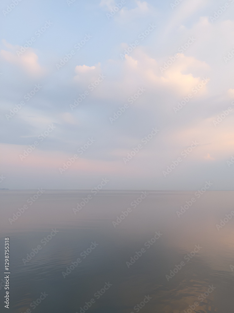 Tranquil Lake and Serene Sky with Gentle Clouds in Soft Pastel Colors Tranquil Lake and Serene Sky with Gentle Clouds in Soft Pastel Colors