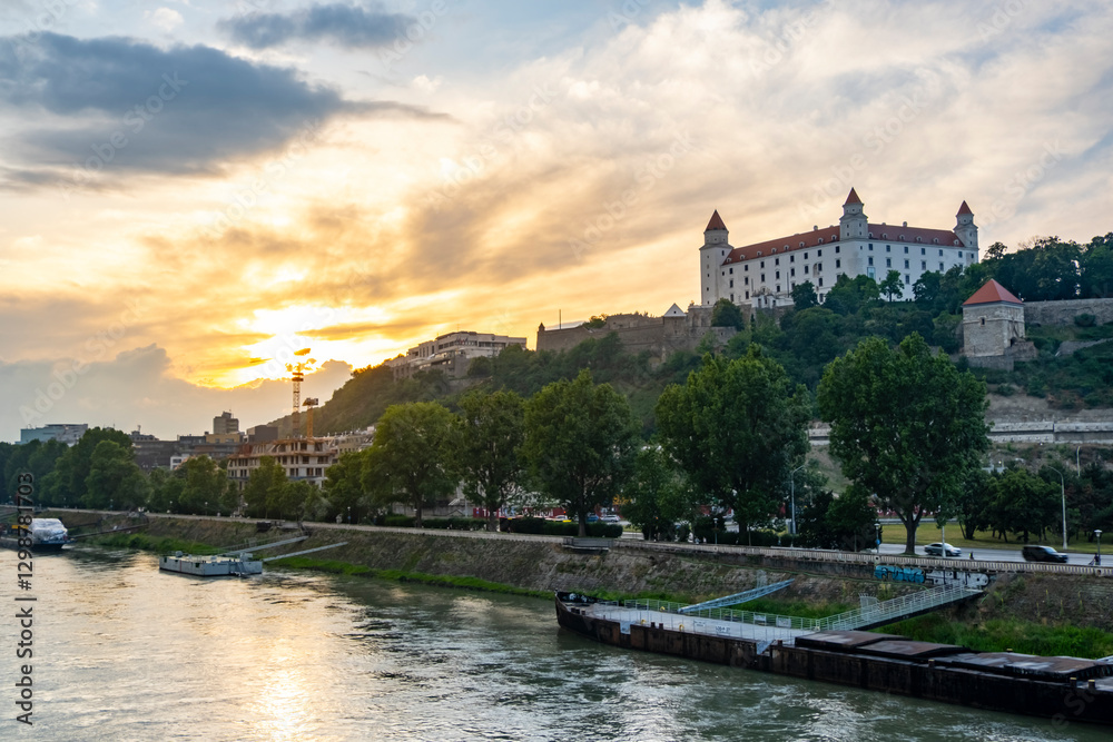 Obraz premium Sunset panorama of Bratislava Grad and downtown over Donau river, Slovakia capital city