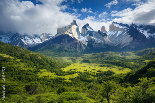 Majestic granite towers of torres del paine rising above lush green valley in patagonia, chile photo