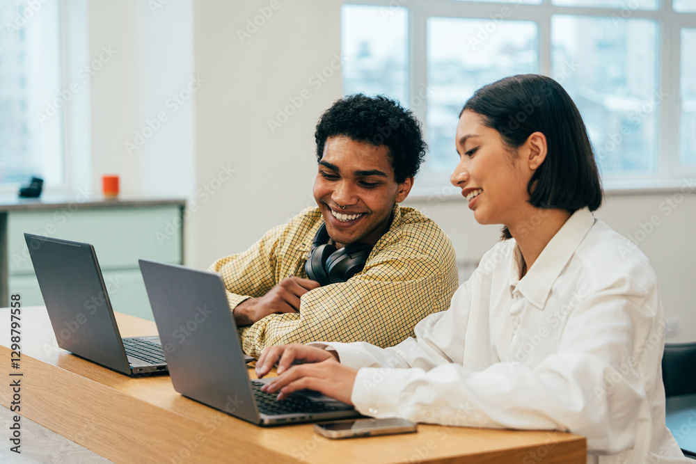 young programmers working on a new project for a start up business. young programmers working on a new project for a start up business.