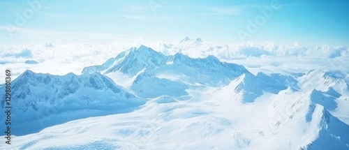 Snow-capped Mountain Peaks Soaring Above a Sea of Clouds