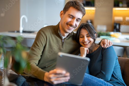 Wallpaper Mural Happy couple in love surfing on tablet at home Torontodigital.ca