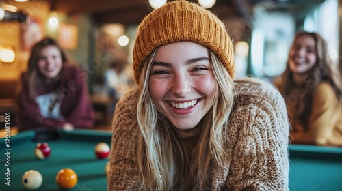 Happy teen girl laughing at pool table