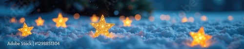 Golden star decorations are spread out across a snowy surface like stars in the night sky, snow,
