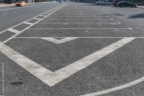 Road markings of a parking lot on an asphalt square.