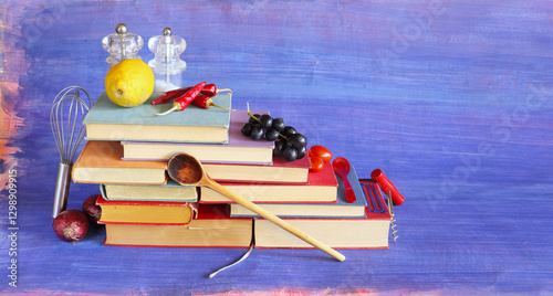 Cookbooks,recipe books,with vegetables and food ingredients, cooking,preparing food, eat and restaurant concept