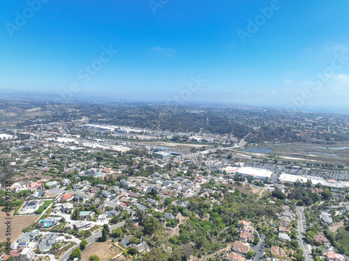 Aerial view of middle class houses in the valley of Oceanside town in San Diego, California. USA.