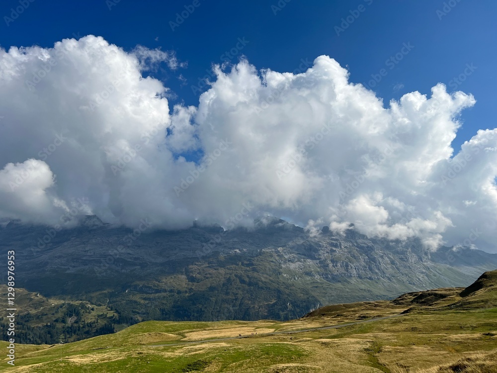 Beautiful photogenic clouds over the Uri Alps massif in the Swiss Alps, Melchtal - Canton of Obwalden, Switzerland (Kanton Obwald, Schweiz) Beautiful photogenic clouds over the Uri Alps massif in the Swiss Alps, Melchtal - Canton of Obwalden, Switzerland (Kanton Obwald, Schweiz)