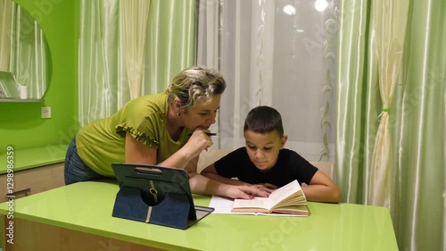 Wallpaper Mural Mother helps her son with his homework. The concept of school education. Torontodigital.ca