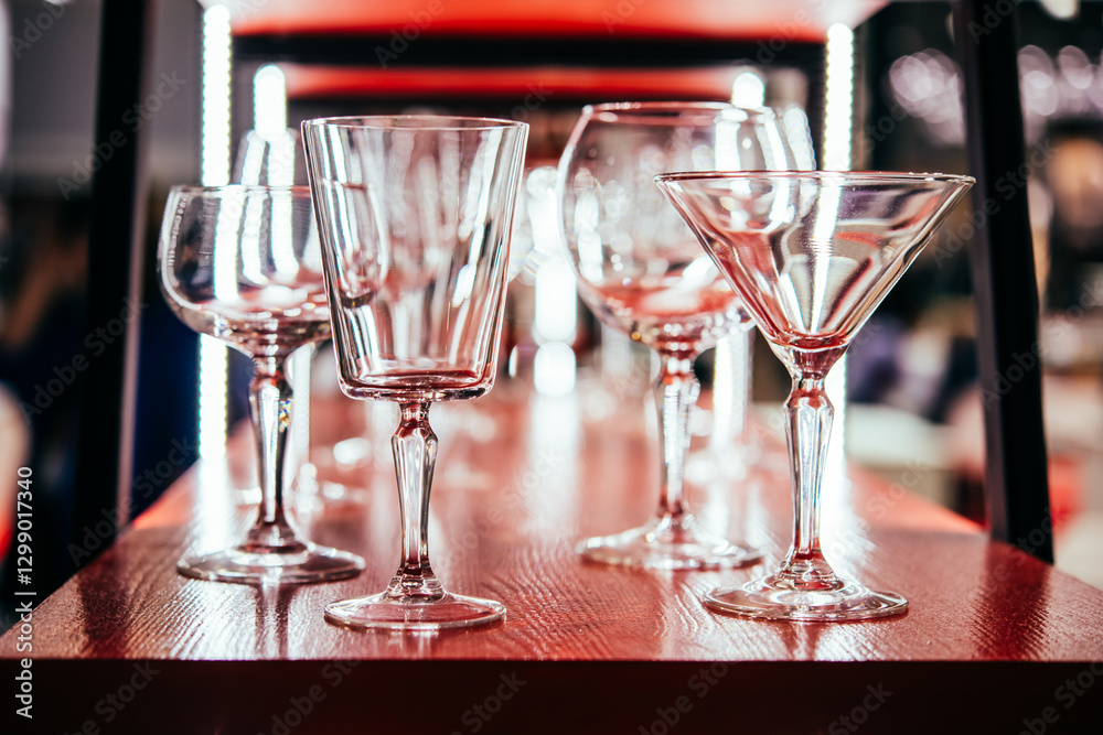 Different wine glasses ready for wine tasting in a bar of restaurant or wine expo.