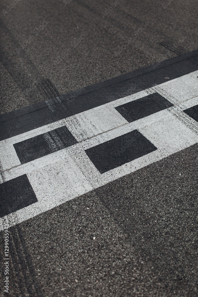 Fototapeta premium Asphalt racing track finish line side view