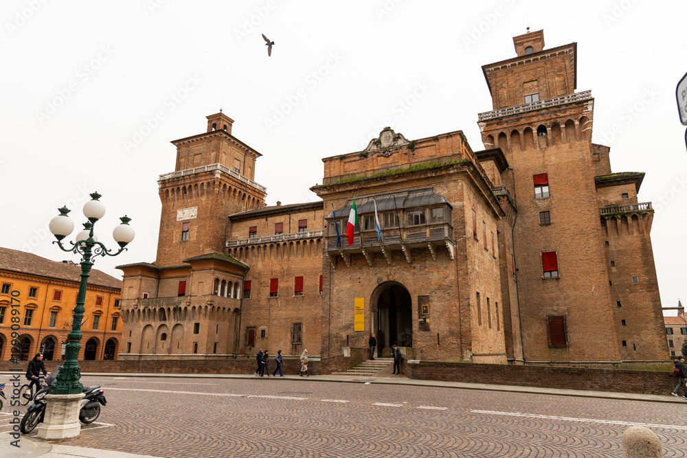 Fototapeta premium Ferrara, Ferrara,Italy March 29 2024 historic center, fortifications and castle surrounded by a moat. Squares and buildings in medieval style.Beautiful, unique Italian cities. World cultural heritage.