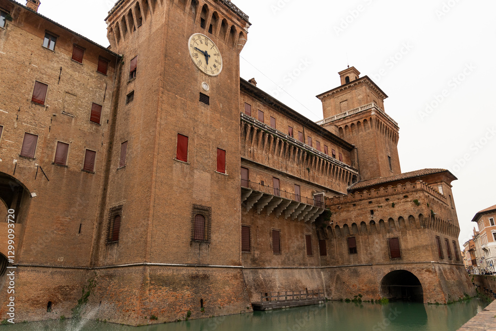 Fototapeta premium Ferrara, Ferrara,Italy March 29 2024 historic center, fortifications and castle surrounded by a moat. Squares and buildings in medieval style.Beautiful, unique Italian cities. World cultural heritage.