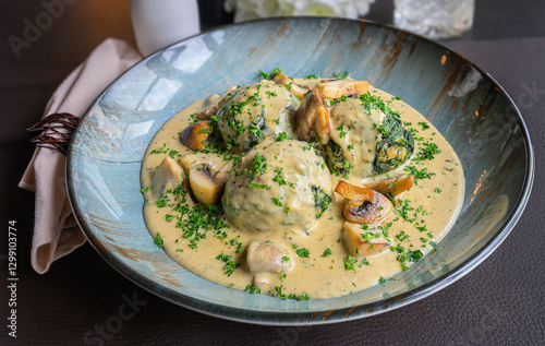 spinach dumplings in creamy mushroom sauce