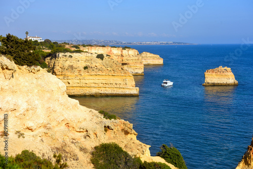 walking path with breathtaking views through the coast from porches to benagil caves lagoa algarve portugal