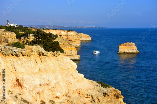 walking path with breathtaking views through the coast from porches to benagil caves lagoa algarve portugal