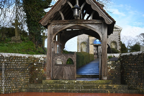 arched church entrance to grave yard and church