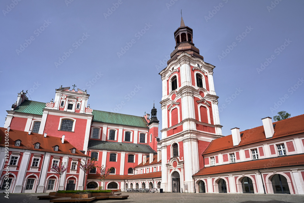Fototapeta premium courtyard with baroque buildings and a bell tower of a former monastery in the city of Poznan