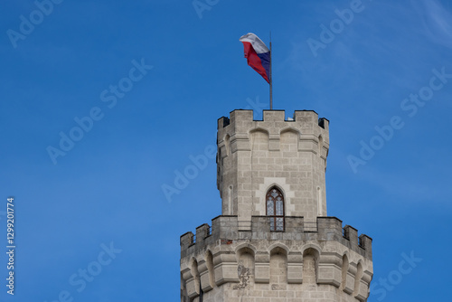 Tower of castle with flag, Hluboka nad Vltavou, Czechia