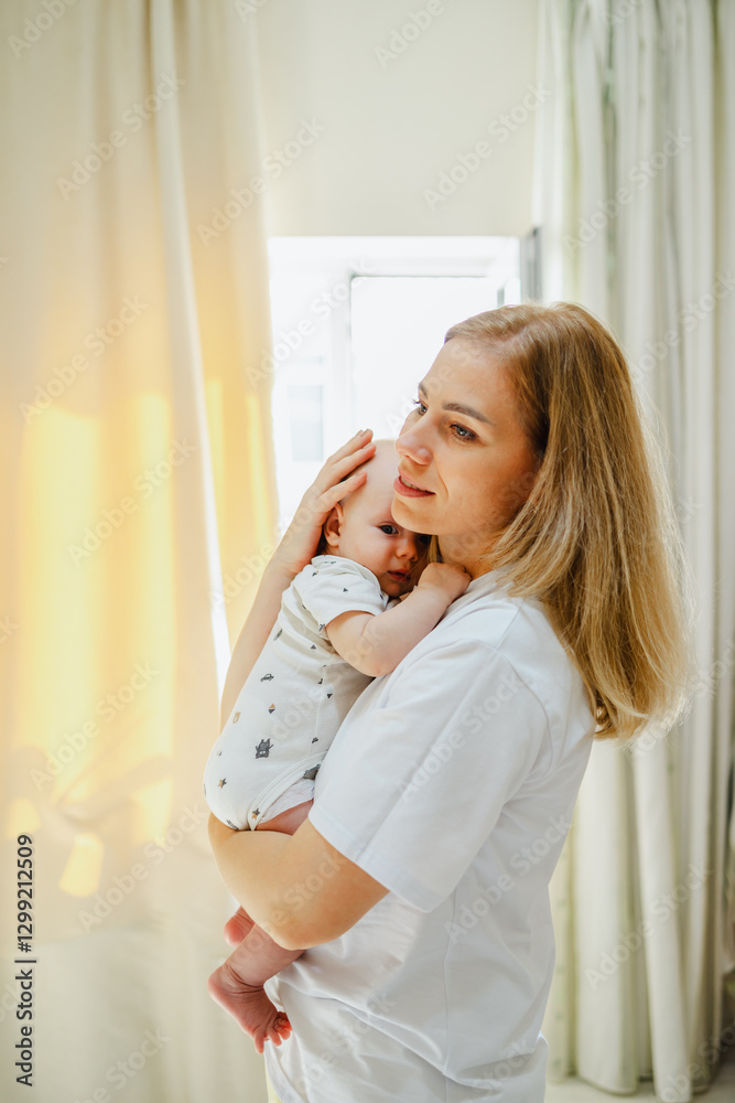 Tender moment between mother and baby in soft sunlight Tender moment between mother and baby in soft sunlight