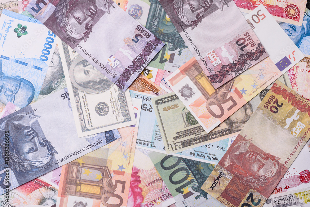 Obraz premium A background consisting of paper banknotes of different currencies