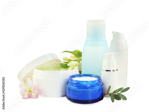 Different body care products and flowers isolated on white