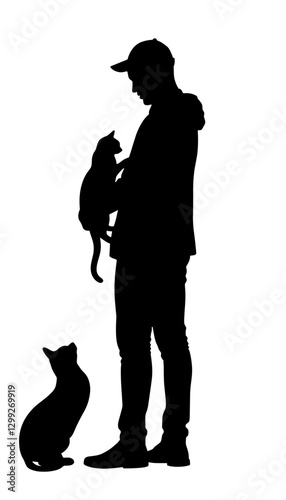 Silhouette of a person holding a cat indoors, joyful companionship