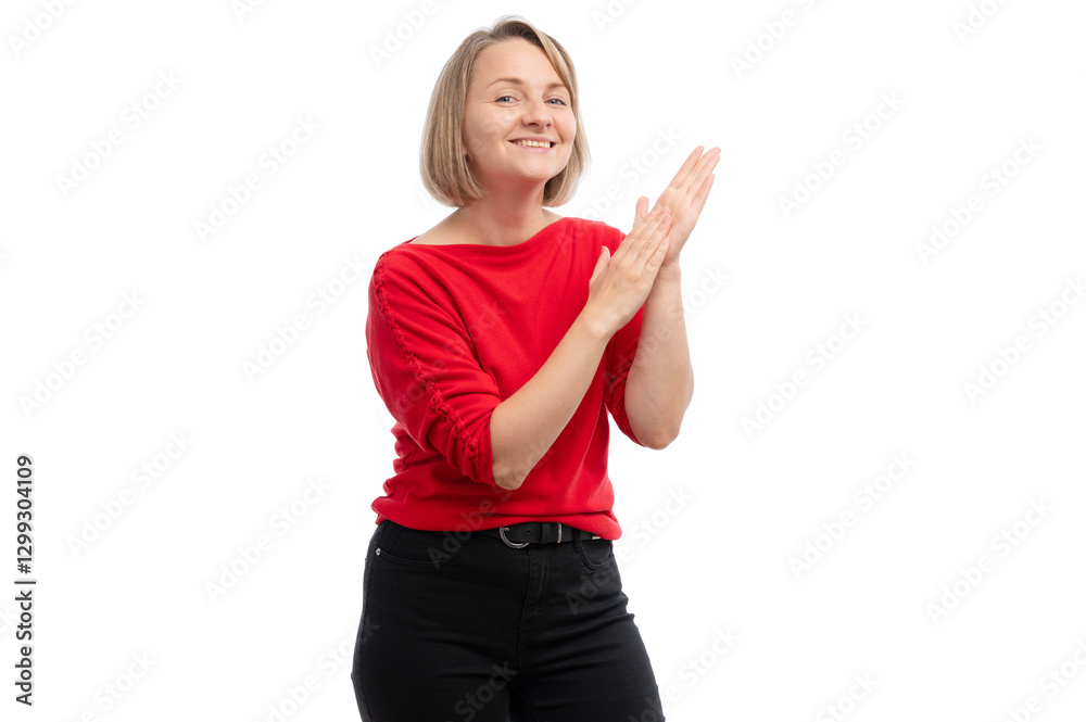 A young woman in a red sweater clapping her hands and smiling against a white background. A young woman in a red sweater clapping her hands and smiling against a white background.