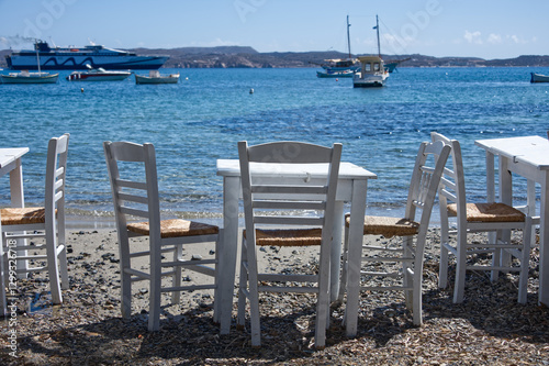 Taverna tables at the beach in a blue landscape photo