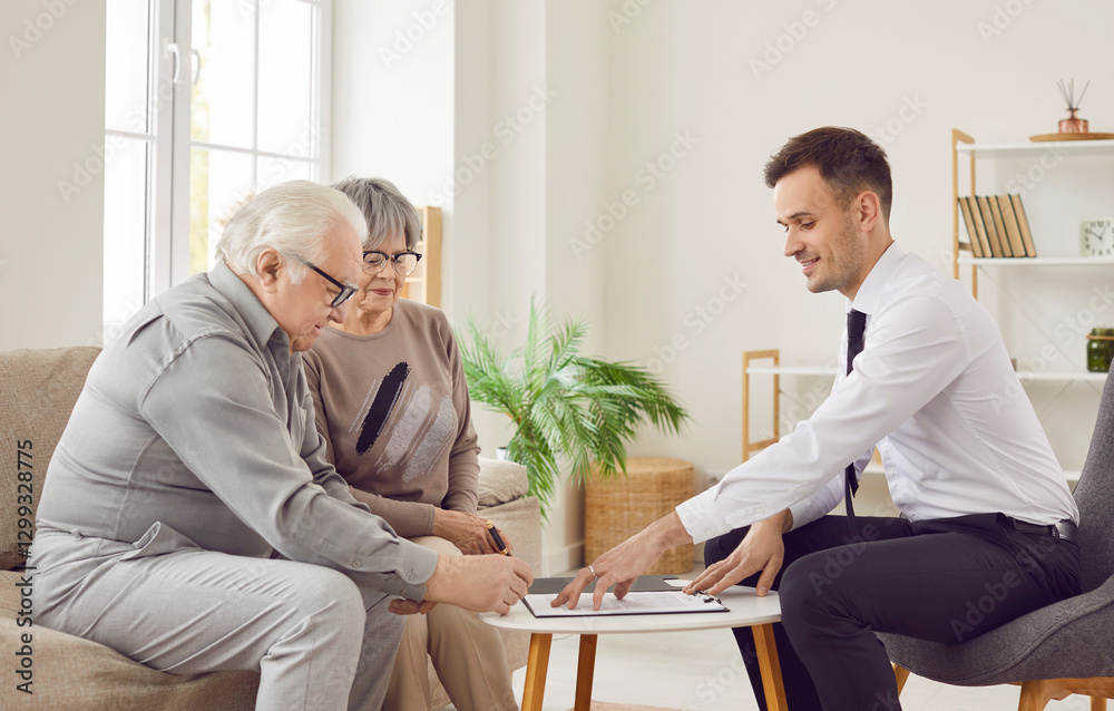 Obraz premium Elderly couple of clients signing a contract with a financial consultant. Couple commitment to their investment planning, guided by the professional advice and support of the agent.