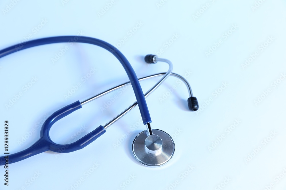Stethoscope on light background, top view. Medical tool Stethoscope on light background, top view. Medical tool