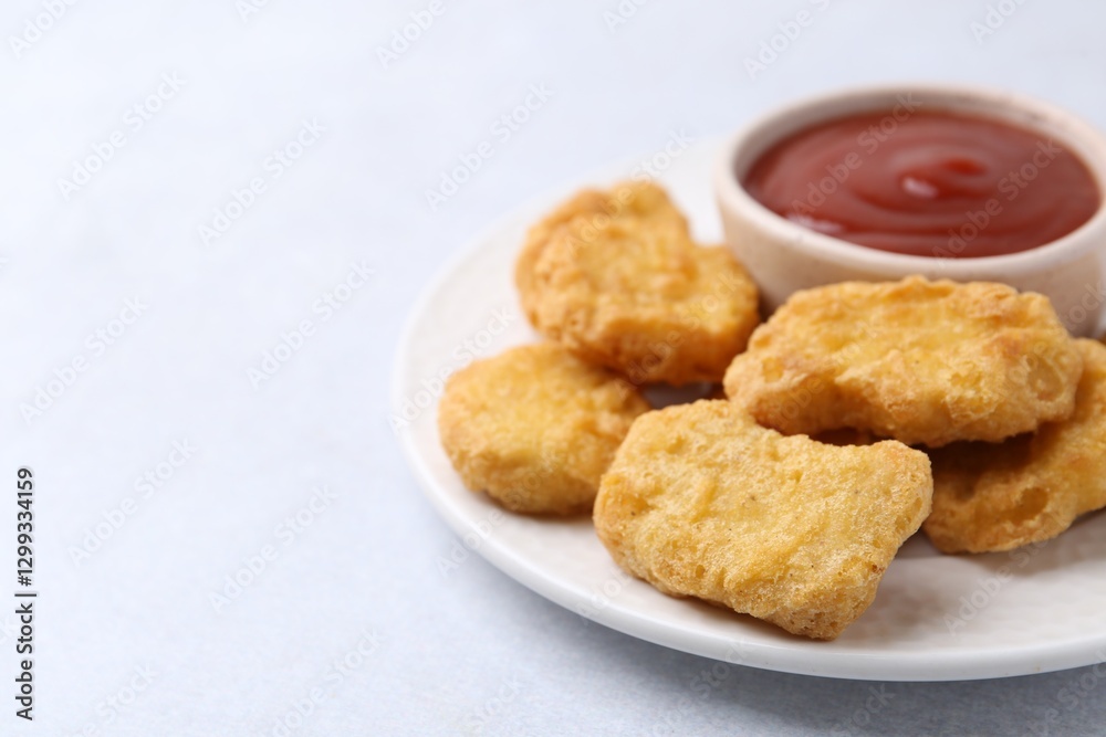 Tasty chicken nuggets with sauce on white background, closeup. Space for text Tasty chicken nuggets with sauce on white background, closeup. Space for text