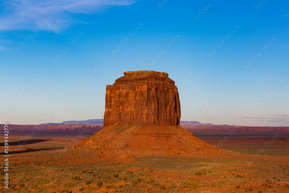 Afternoon light on sandstone buttes in the desert of Monument Valley, in Arizona and Utah. Afternoon light on sandstone buttes in the desert of Monument Valley, in Arizona and Utah.