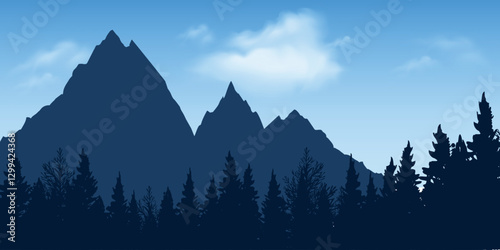 Mountainous landscape with silhouettes of coniferous forest in the foreground and majestic mountains against the blue sky.