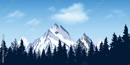 Snowy mountain peaks against the backdrop of a forest under a clear blue sky.